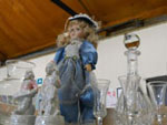 Small Doll and Glassware